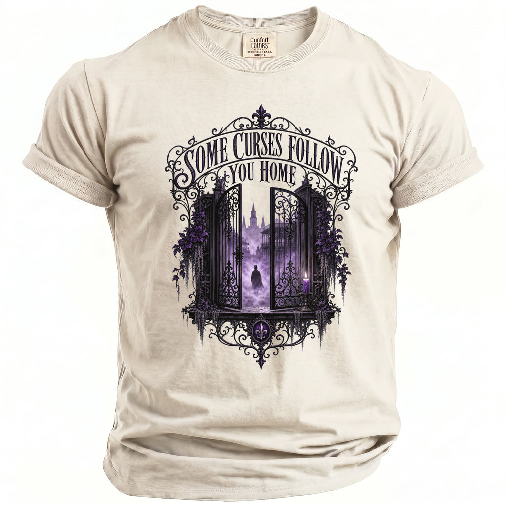 Cream t-shirt with "Some Curses Follow You Home" graphic featuring purple gates and a cloaked figure.