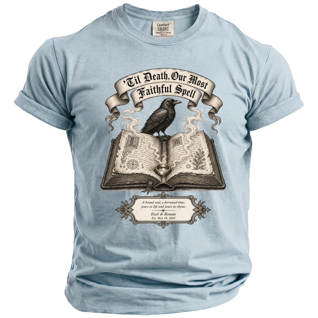 Light blue t-shirt with raven on open book, reading 'Til Death, Our Most Faithful Spell'.