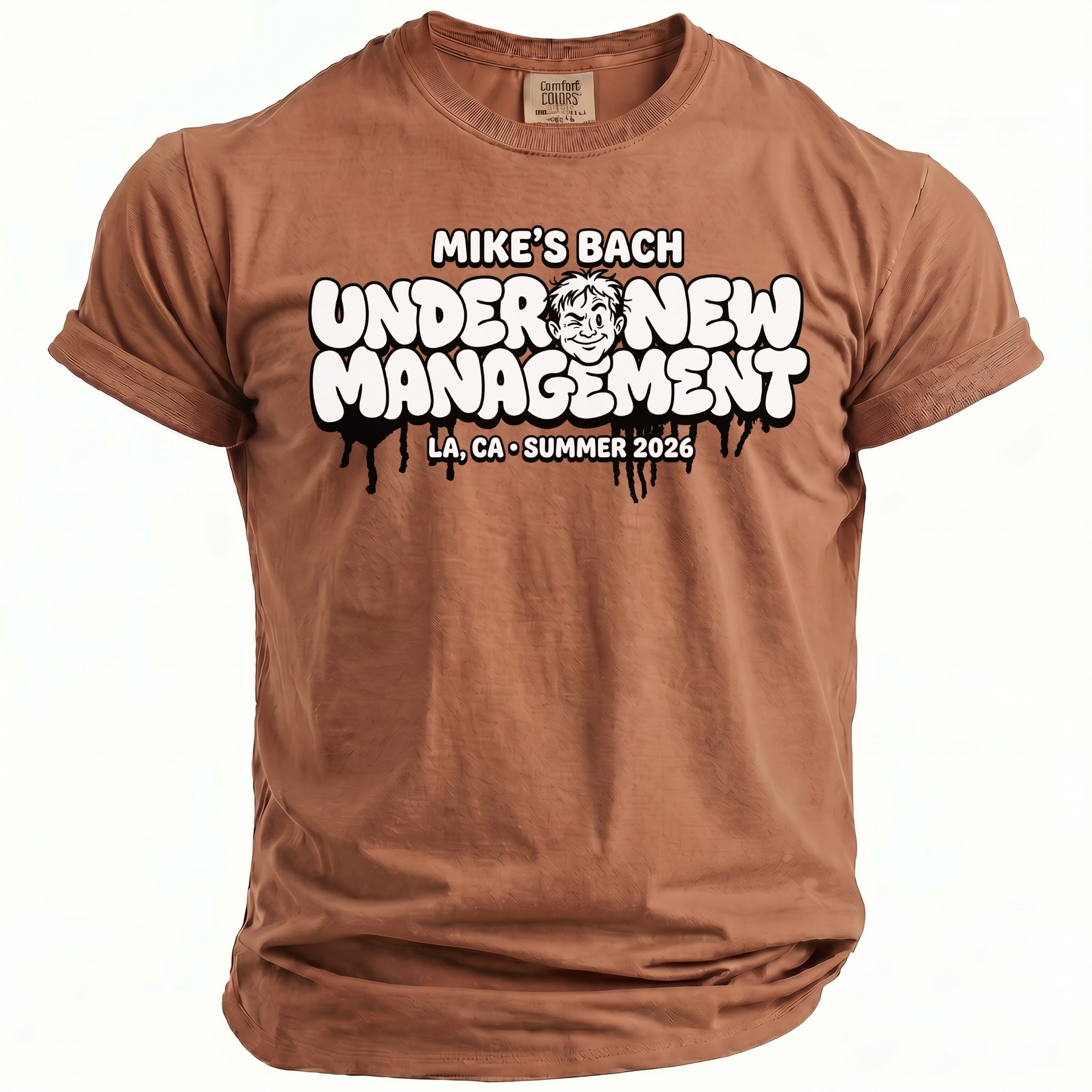 Brown t-shirt with "MIKE'S BACH UNDER NEW MANAGEMENT" text and cartoon.