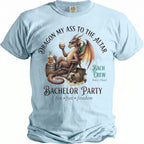 Light blue t-shirt with a dragon, whiskey, dice, and "Bachelor Party" text.