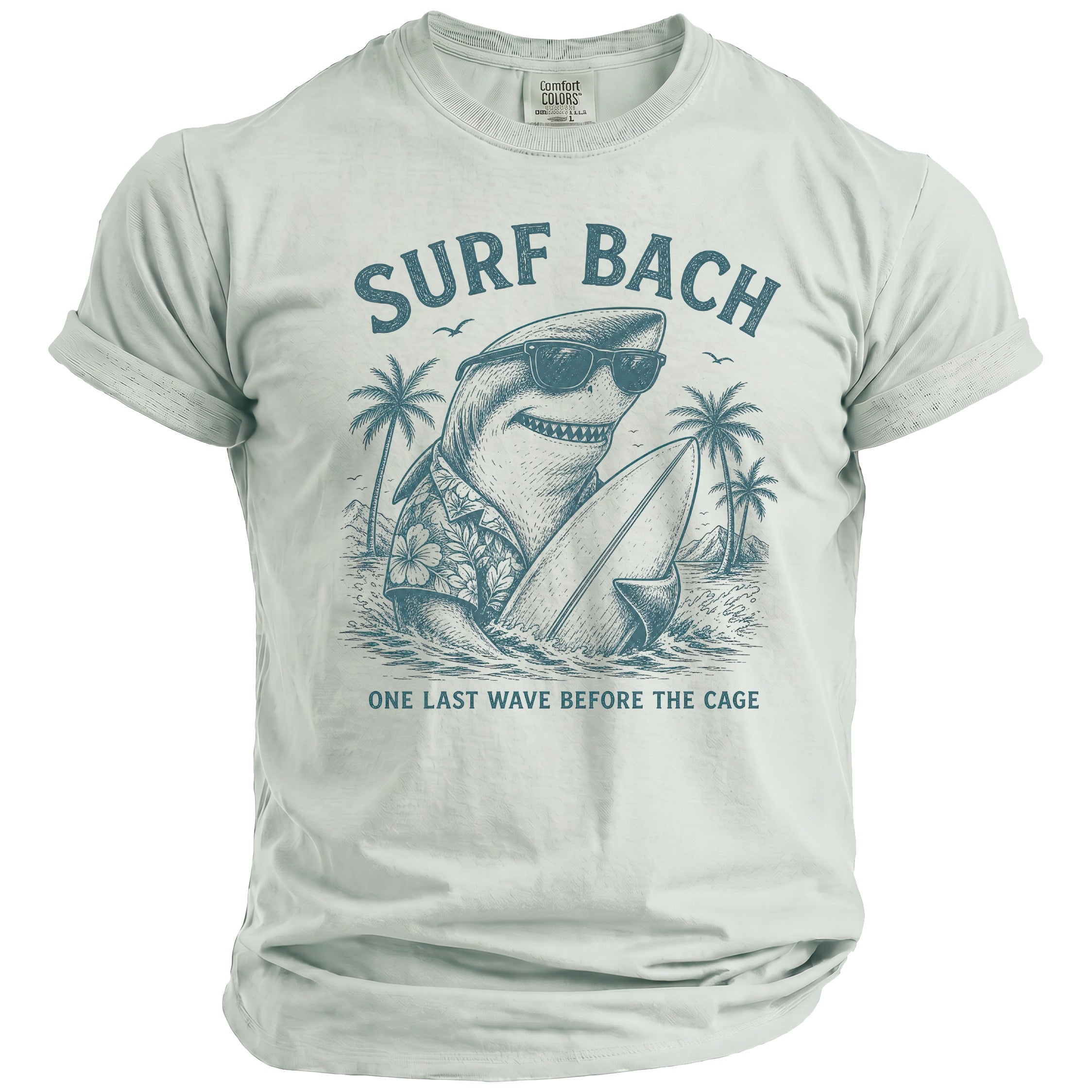 T-shirt with graphic of a shark in sunglasses and Hawaiian shirt holding a surfboard, text reads "SURF BACH ONE LAST WAVE BEFORE THE CAGE".