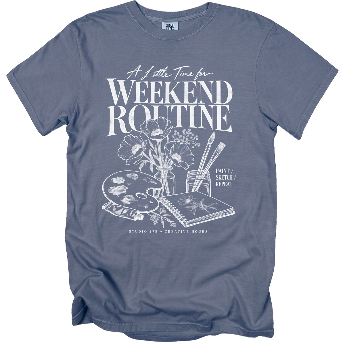 Grey t-shirt with "A Little Time for Weekend Routine" and art supplies.