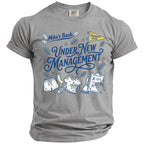 Grey t-shirt with "Mike's Bach UNDER NEW MANAGEMENT" and bachelor party graphics.
