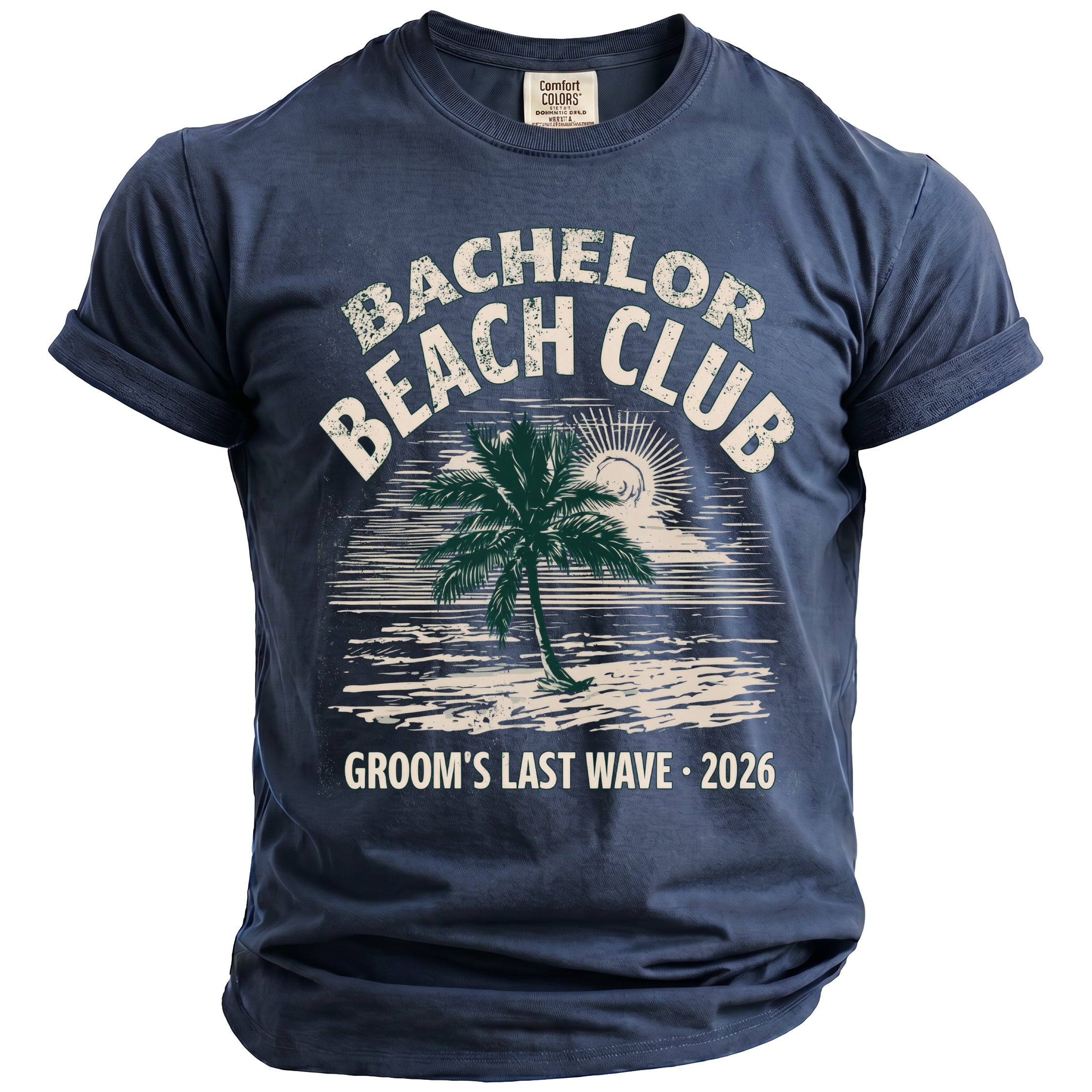 Navy t-shirt graphic with palm tree, sun, and text: Bachelor Beach Club, Groom's Last Wave, 2026.