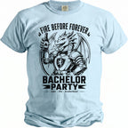 Light blue t-shirt with black graphic of a dragon holding a beer bottle, text reads "Fire Before Forever" and "Bachelor Party".