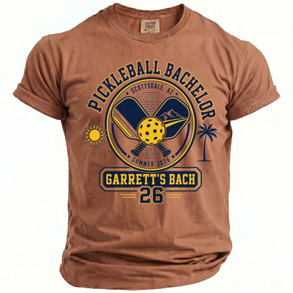 Brown t-shirt with "Pickleball Bachelor Scottsdale, AZ Summer 2026 Garrett's Bach 26" graphic.