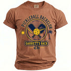 Brown t-shirt with "Pickleball Bachelor Scottsdale, AZ Summer 2026 Garrett's Bach 26" graphic.