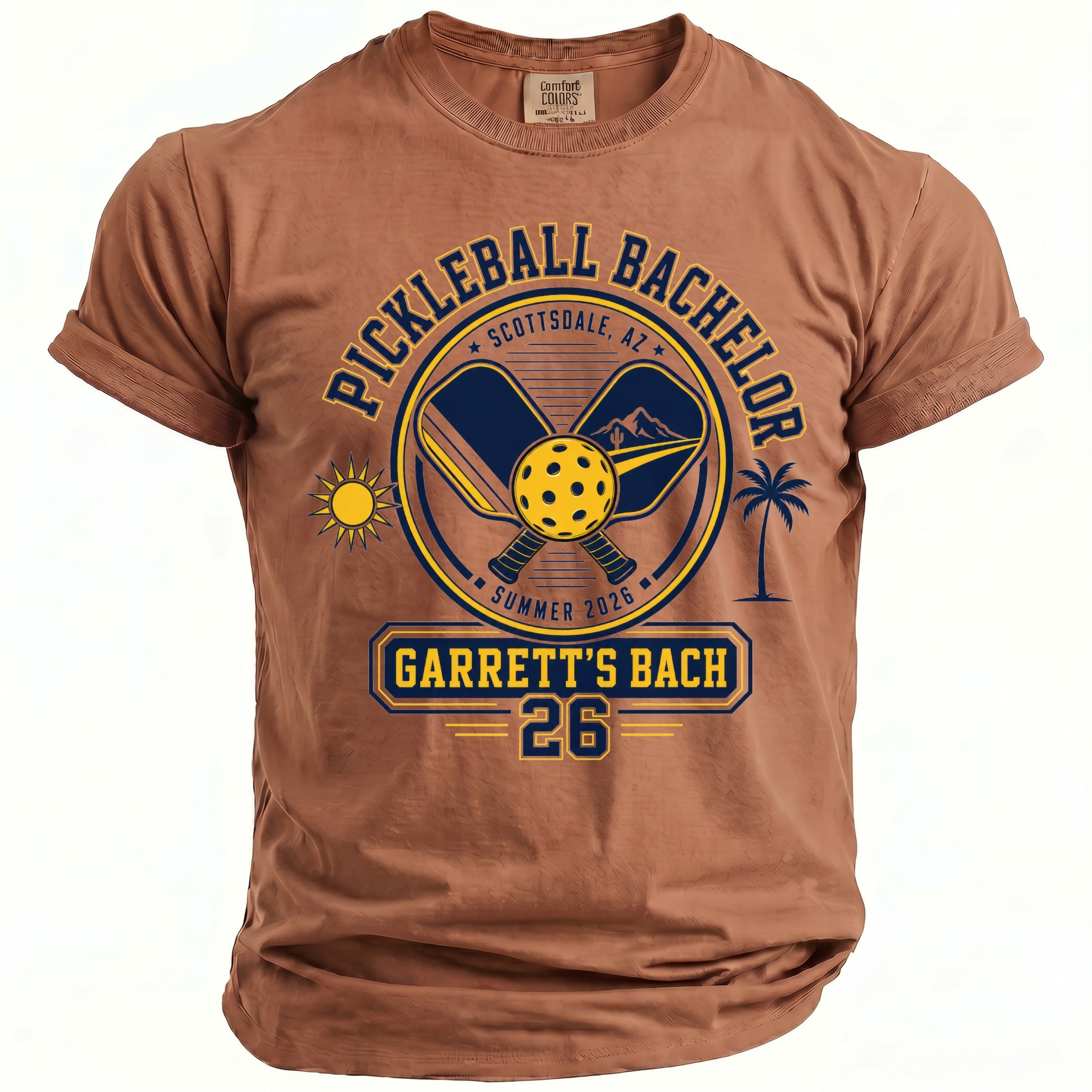 Brown t-shirt with "Pickleball Bachelor Scottsdale, AZ Summer 2026 Garrett's Bach 26" graphic.