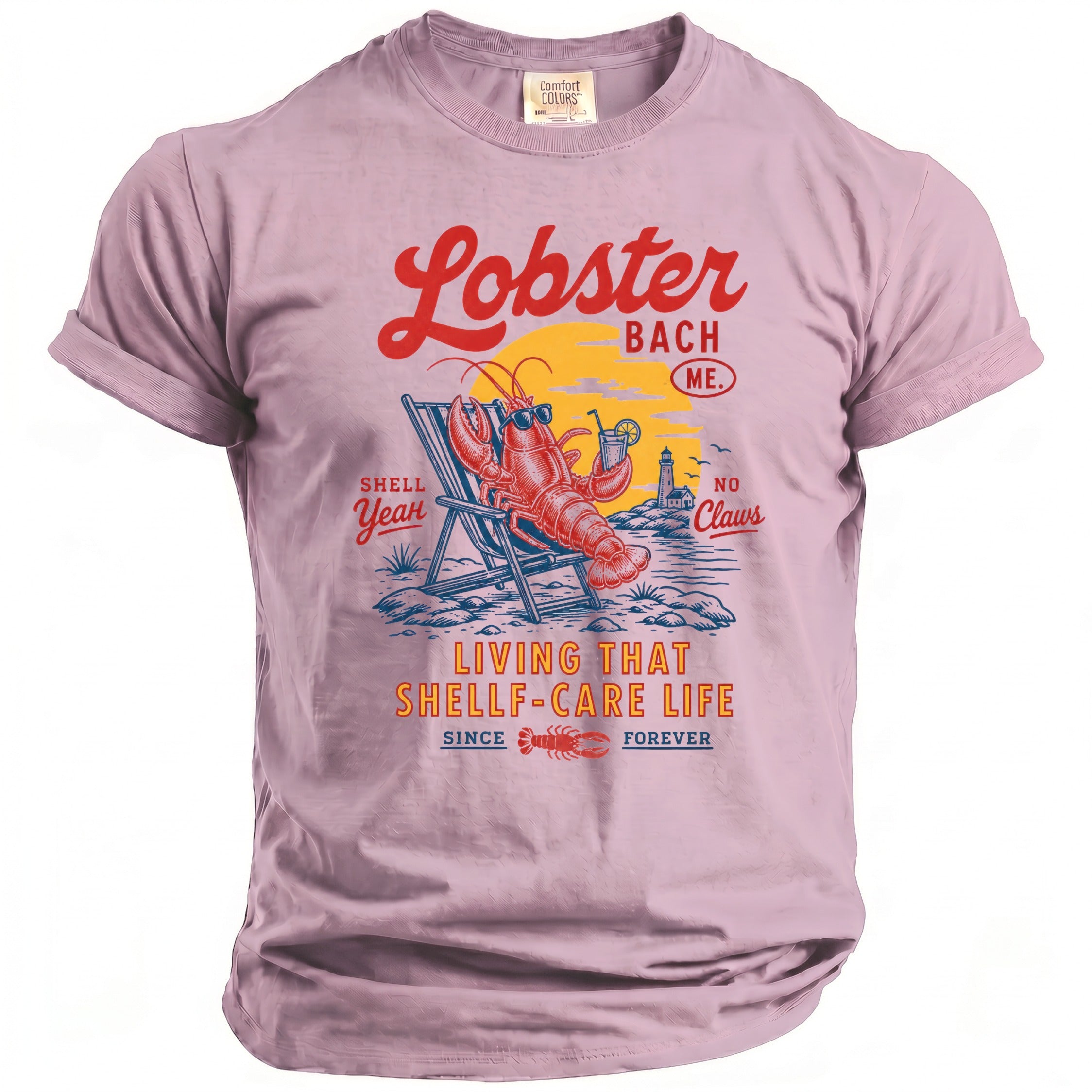 Pink t-shirt with lobster relaxing on beach, "Lobster Bach ME" and "Living That Shellf-Care Life" text.