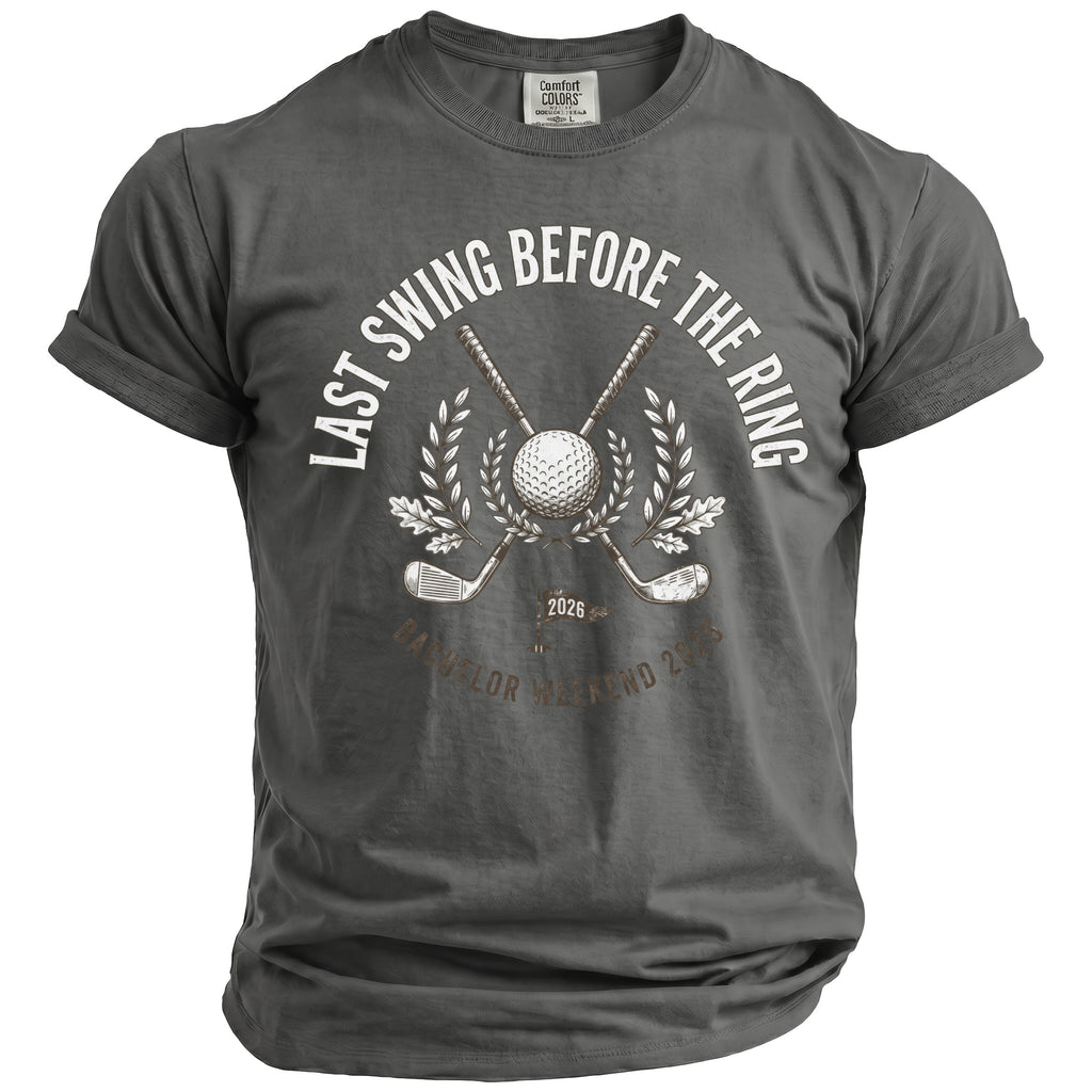 Gray t-shirt with white text "Last Swing Before The Ring" and golf graphics.