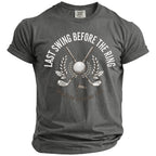 Gray t-shirt with white text "Last Swing Before The Ring" and golf graphics.
