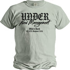 Light green t-shirt with black gothic text "UNDER New Management" and "Mike's Bach LA, CA. Summer 2026".
