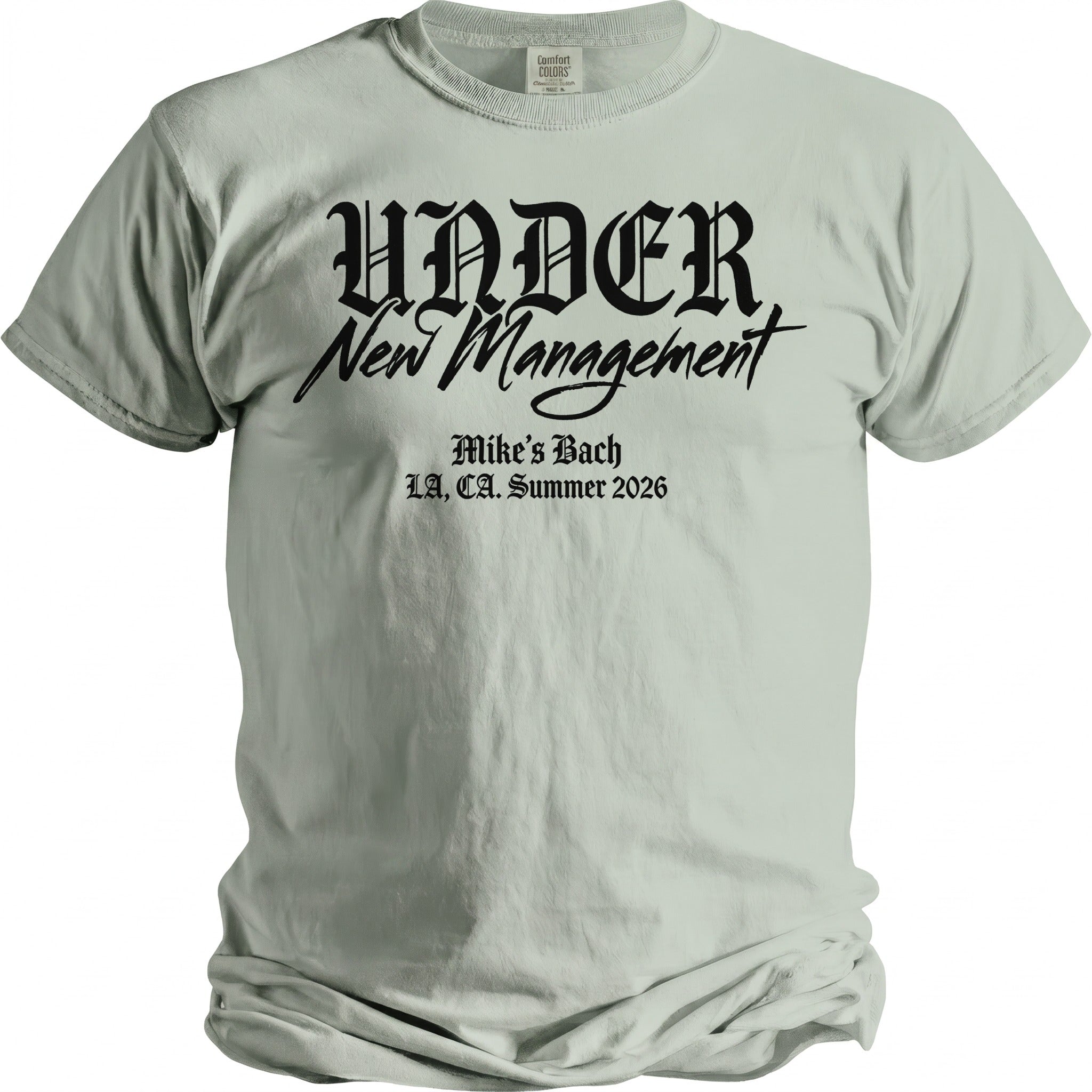 Light green t-shirt with black gothic text "UNDER New Management" and "Mike's Bach LA, CA. Summer 2026".