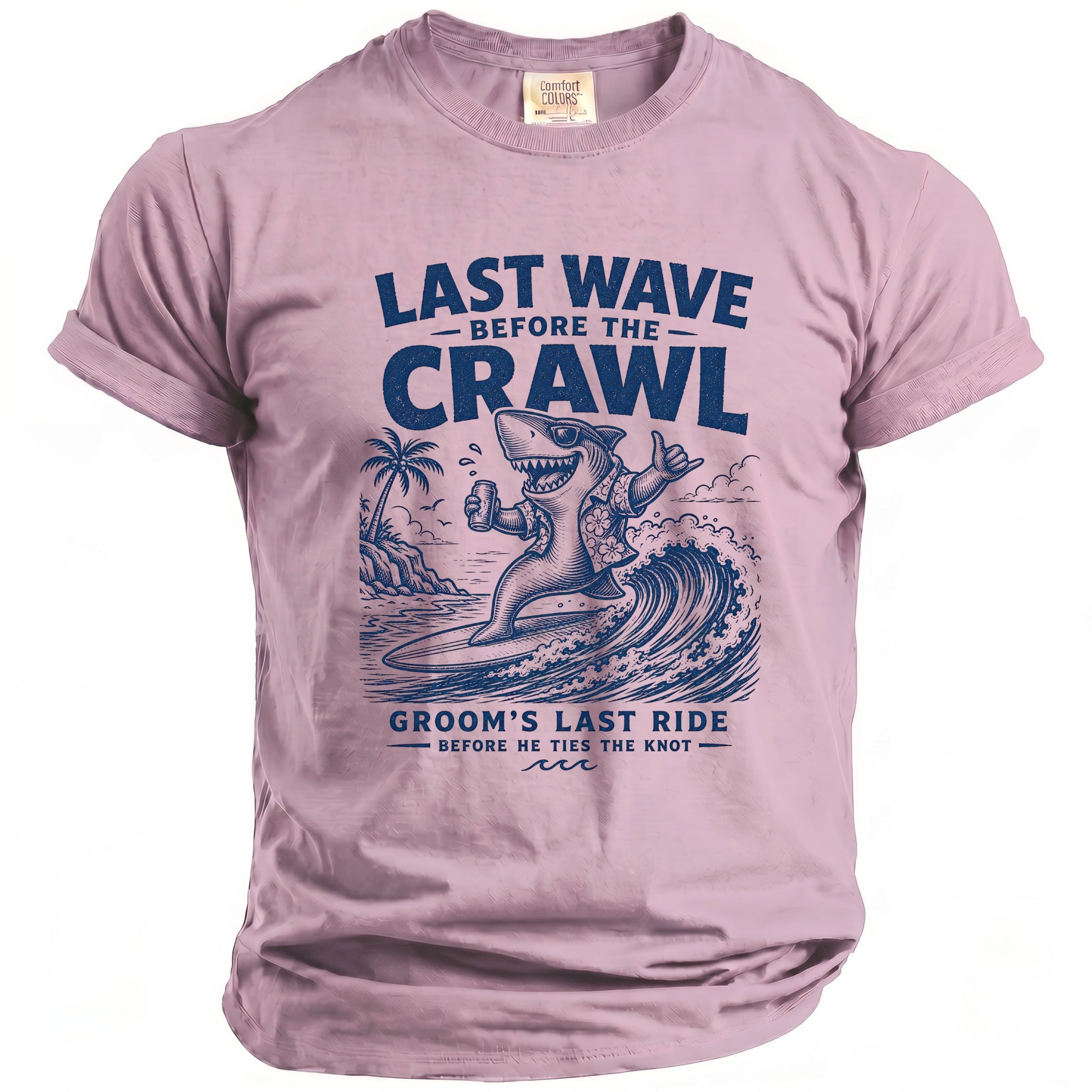 Pink t-shirt with a graphic of a surfing shark holding a beer, text reads "Last Wave Before the Crawl Groom's Last Ride".