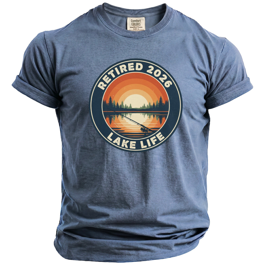 Blue t-shirt with "Retired 2026 Lake Life" graphic of a sunset over a lake with fishing pole.
