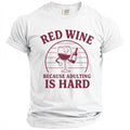 White t-shirt with burgundy text and graphic of wine glass and bottle.