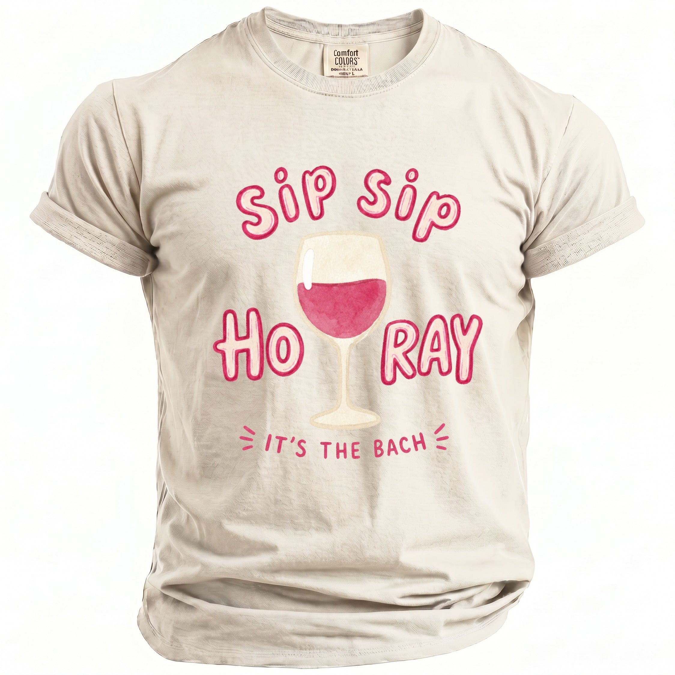 Light beige t-shirt with "sip sip hooray it's the bach" and wine glass graphic.