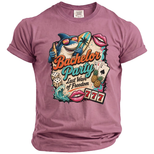 T-shirt with a graphic featuring a shark, surfboard, dice, cards, and text "Bachelor Party Last Wave of Freedom".