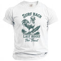 White t-shirt with a rooster surfing and text "Surf Bach Last Roost Before The Toast".