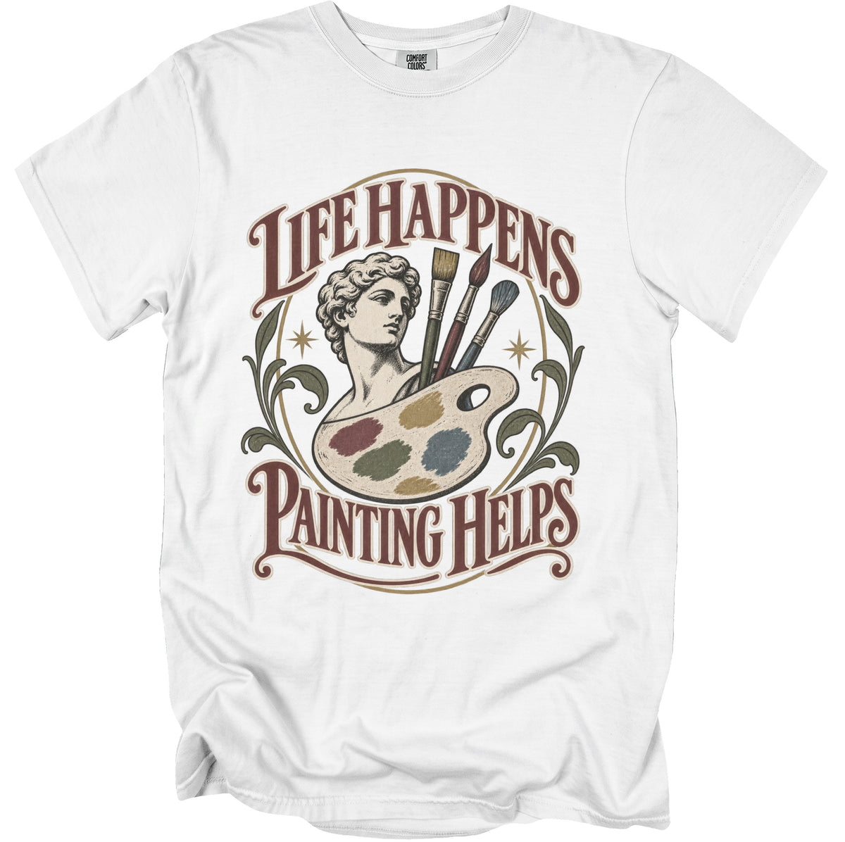 White t-shirt with "Life Happens Painting Helps" text and artist's palette graphic.
