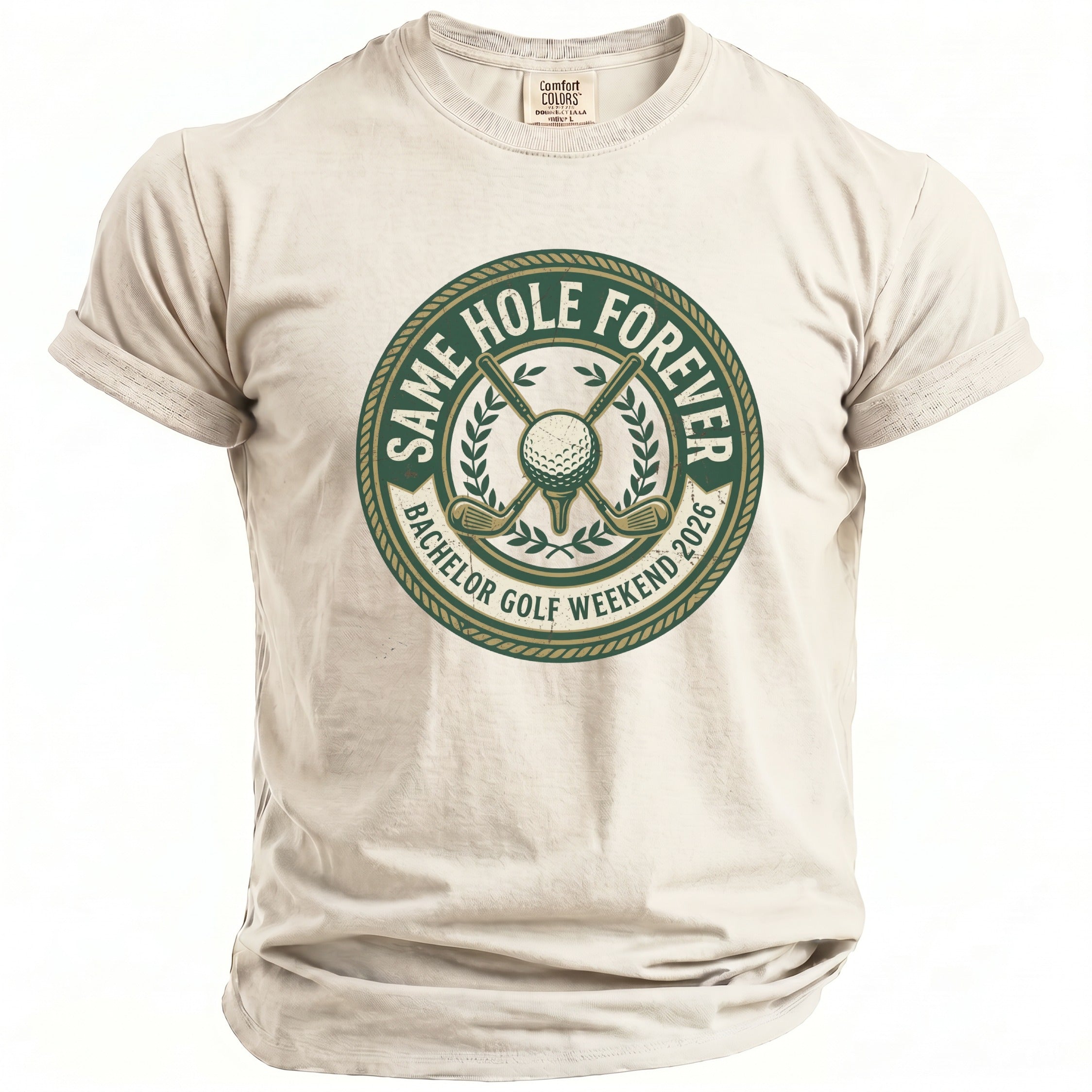 Cream t-shirt with a circular graphic reading "Same Hole Forever Bachelor Golf Weekend 2026."