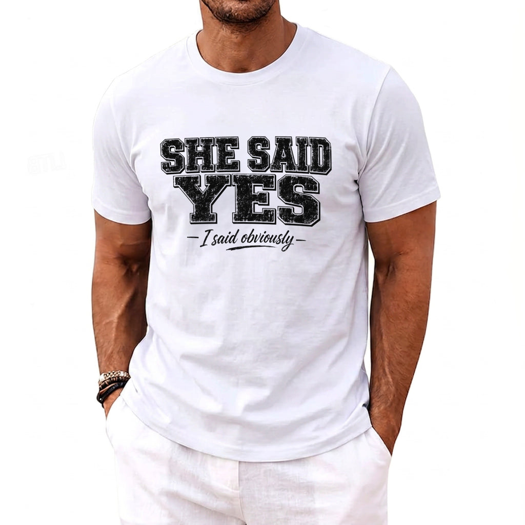 White t-shirt with black text: "SHE SAID YES - I said obviously -"