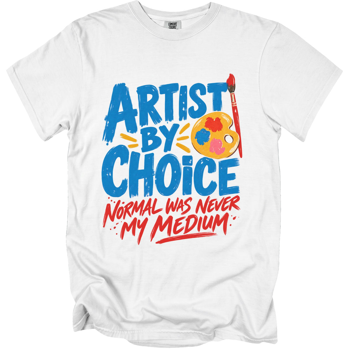 White t-shirt with "Artist by Choice. Normal was never my medium." text and art supplies.