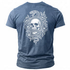 Blue t-shirt with white graphic of snake coiled around skull and flowers.