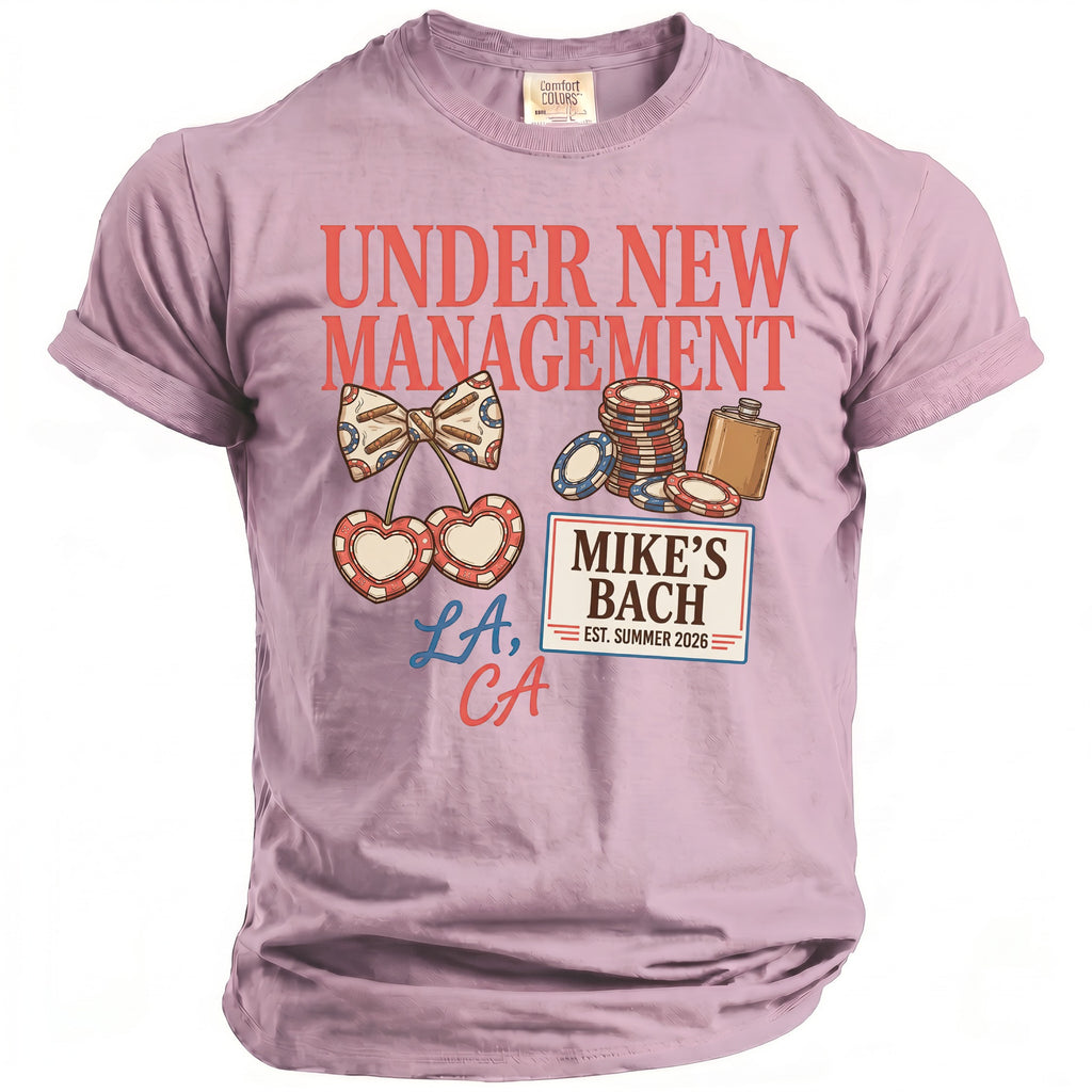 Lavender graphic t-shirt with "UNDER NEW MANAGEMENT" and "MIKE'S BACH" designs.