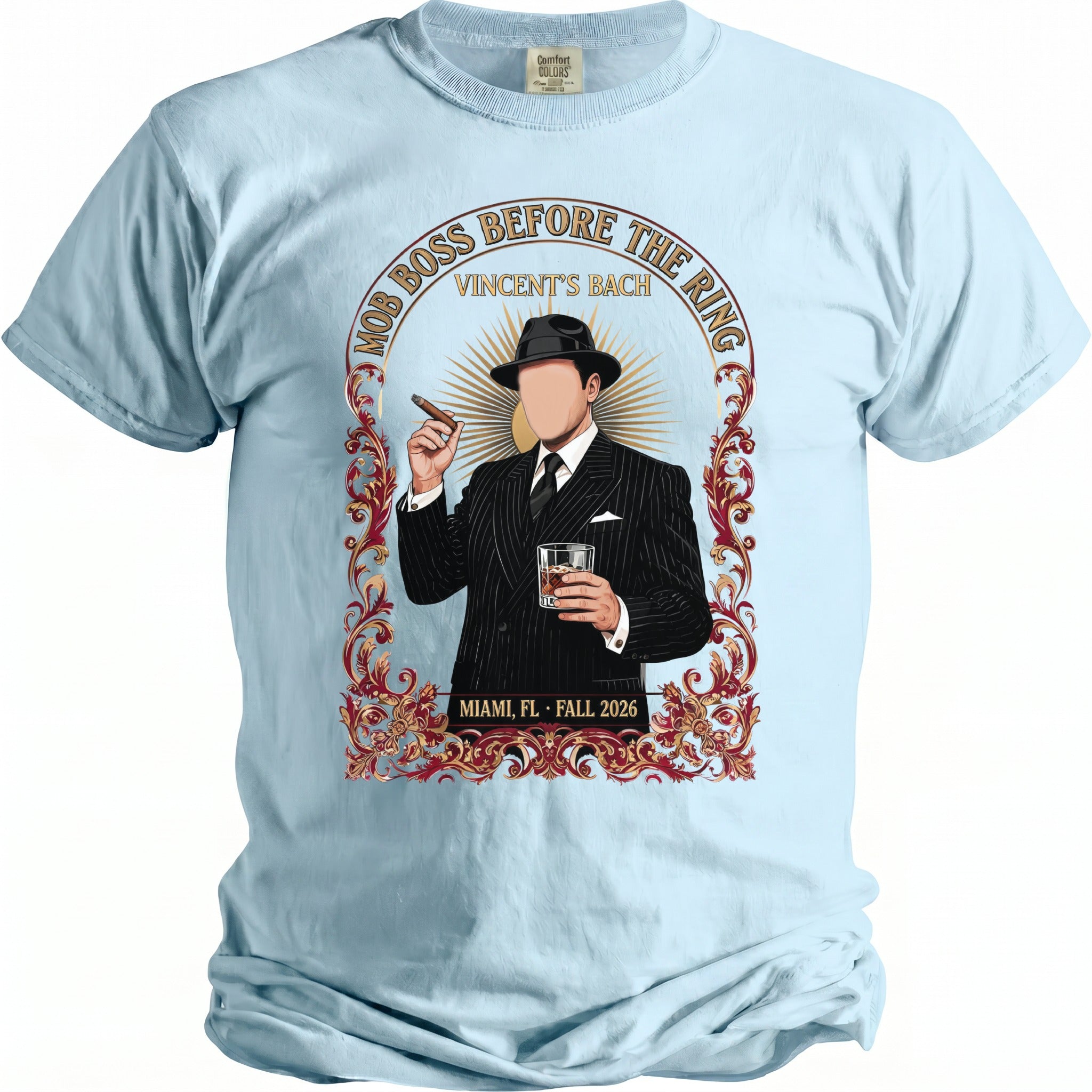 Light blue t-shirt with a graphic of a man in a suit holding a cigar and drink.