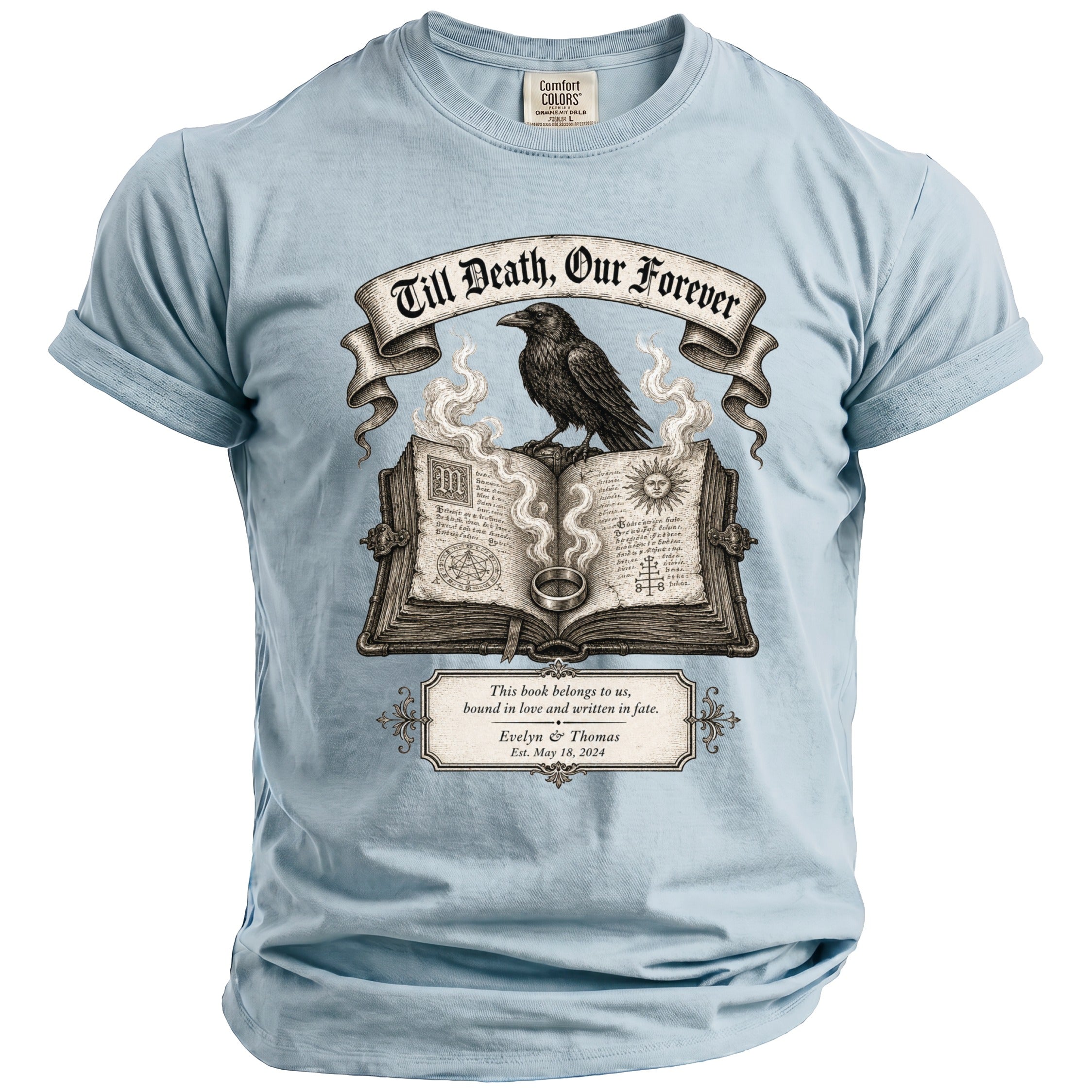 Light blue t-shirt with raven on open book; "Till Death, Our Forever" and "Evelyn & Thomas Est. May 18, 2024".