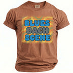 Brown Comfort Colors t-shirt with "BLUES BACH SCENE" text and psychedelic background.