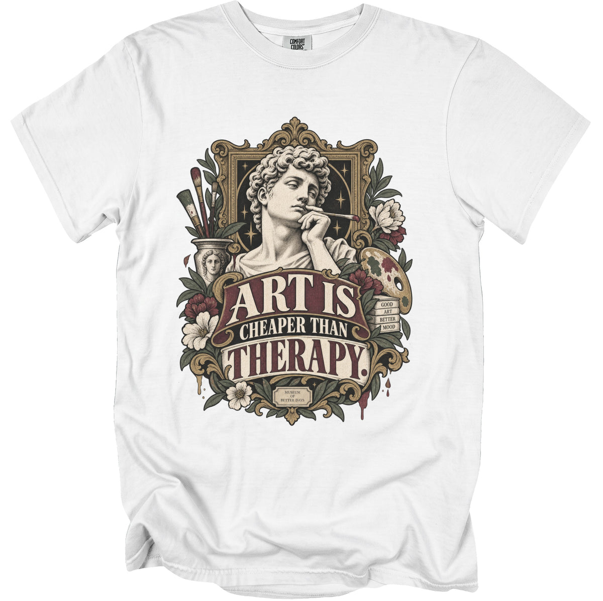 White t-shirt with "Art Is Cheaper Than Therapy" text and classical bust artwork.