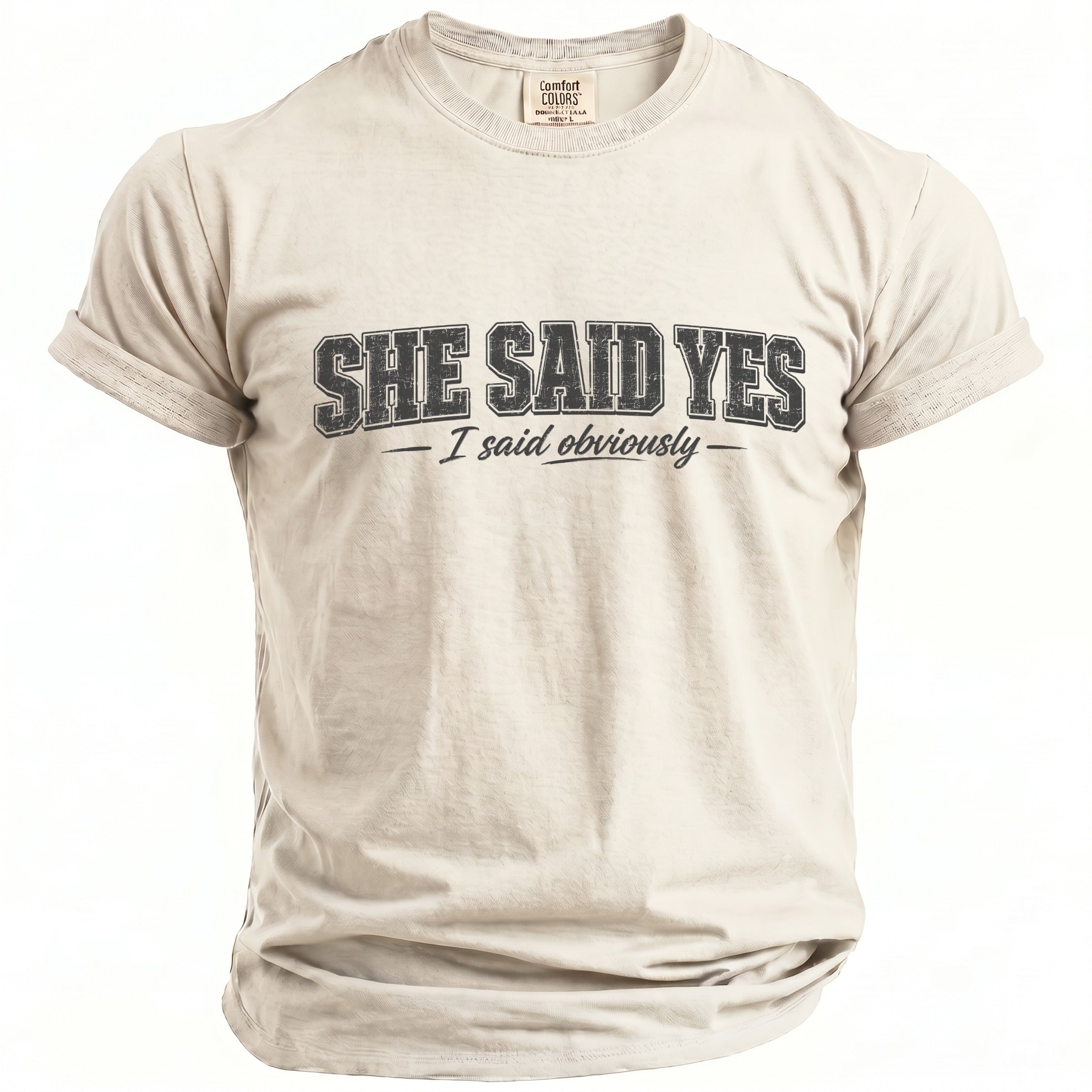 Light beige t-shirt with black text that reads "SHE SAID YES - I said obviously".