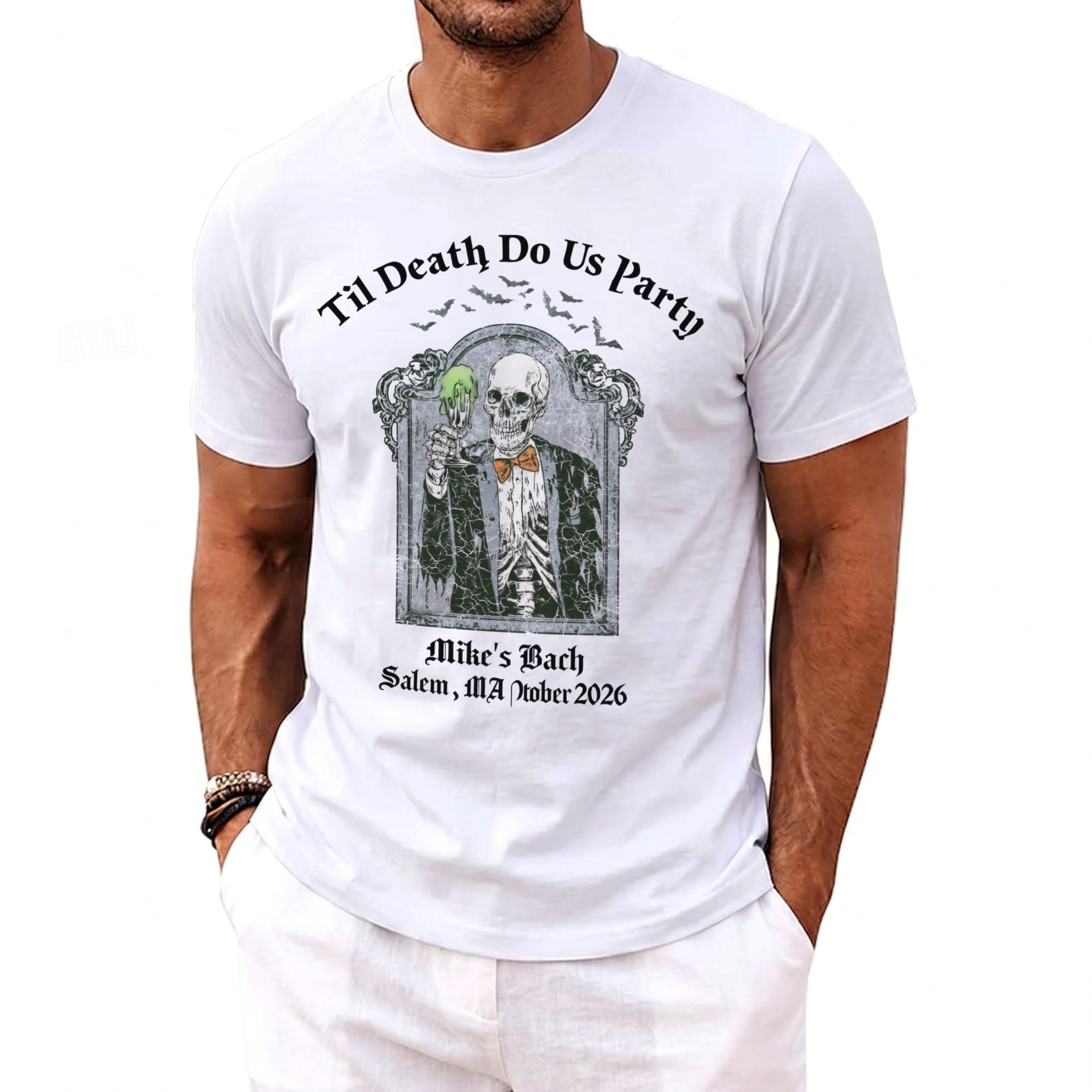 White t-shirt with skeleton in suit and bow tie holding green drink, "Til Death Do Us Party"