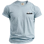 Light blue Comfort Colors t-shirt with a black golf ball and grass graphic on the left chest.