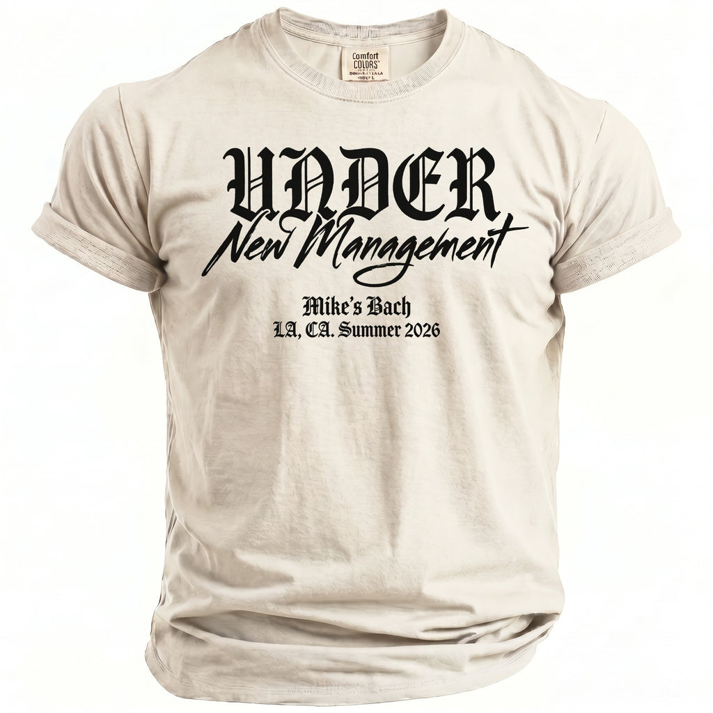 T-shirt with black text: "UNDER New Management Mike's Bach LA, CA. Summer 2026"