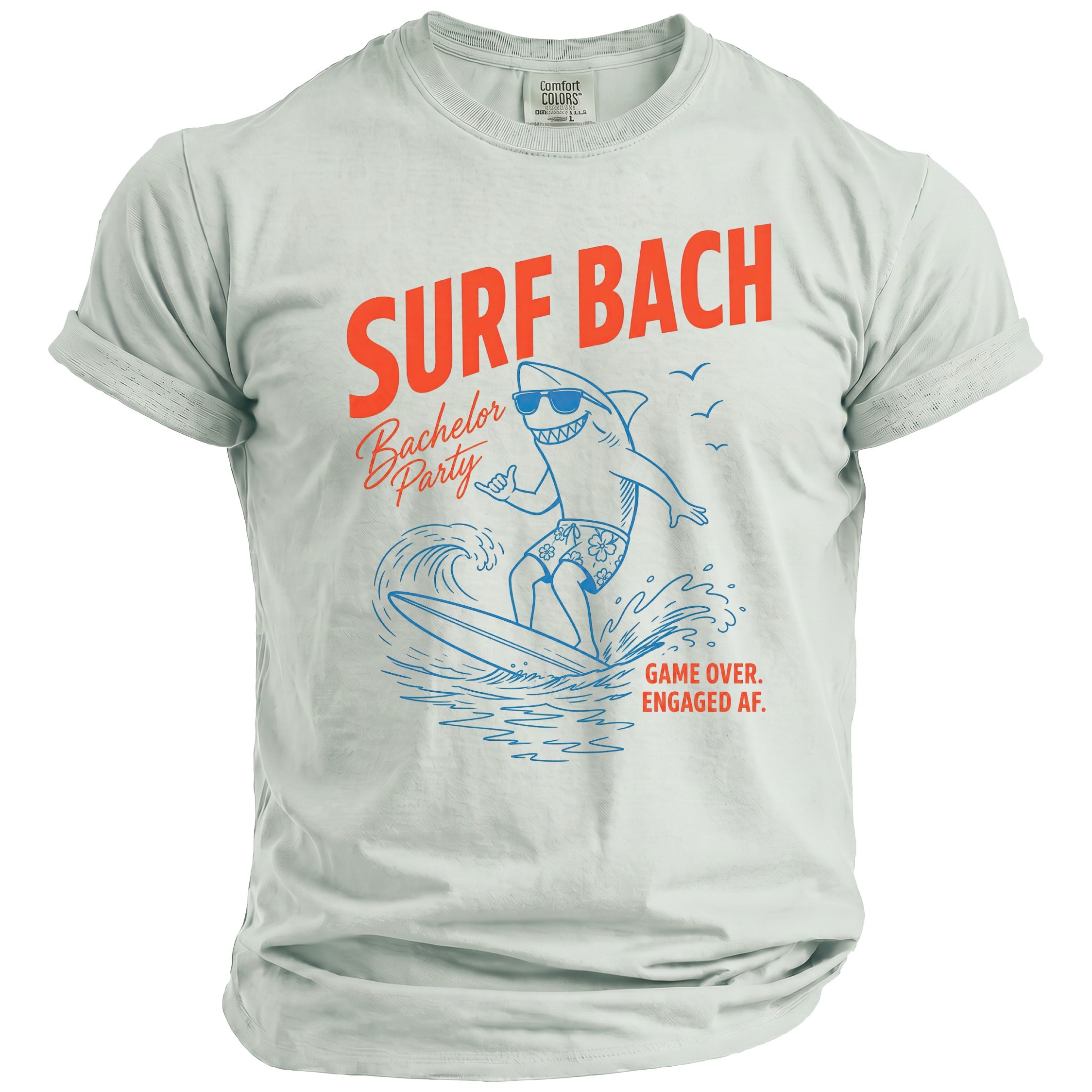 Light blue t-shirt with orange "SURF BACH" text and a shark surfing.