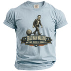 Light blue t-shirt graphic: man in suit dragging a ball and chain, "Dead Man Walking" text.