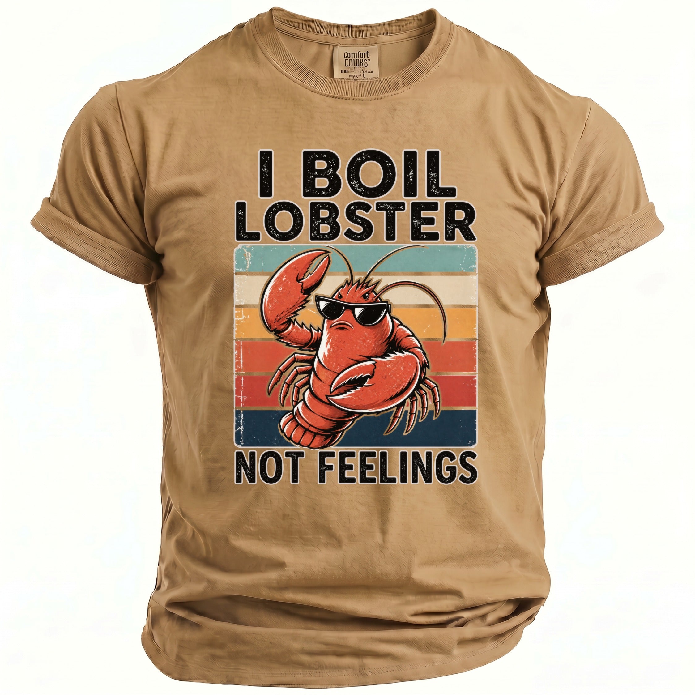 Tan t-shirt with a cartoon lobster wearing sunglasses and text "I BOIL LOBSTER NOT FEELINGS".