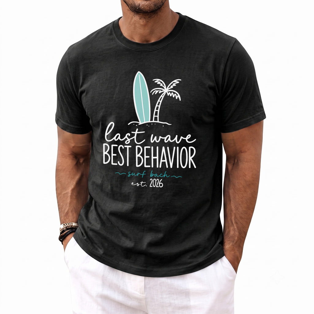 Black t-shirt with "last wave BEST BEHAVIOR surf bach est. 2026" text and graphics.