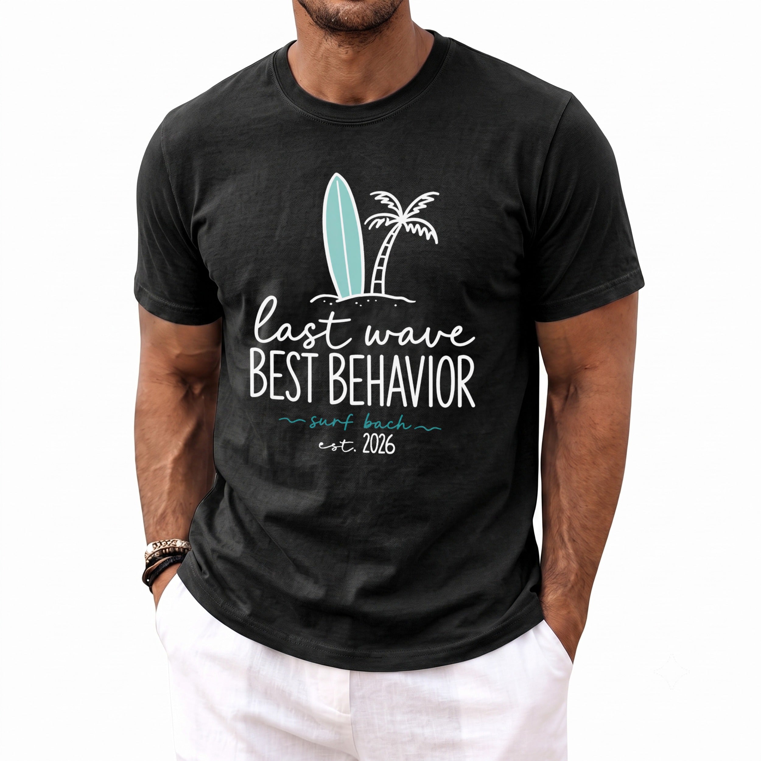 Black t-shirt with "last wave BEST BEHAVIOR surf bach est. 2026" text and graphics.
