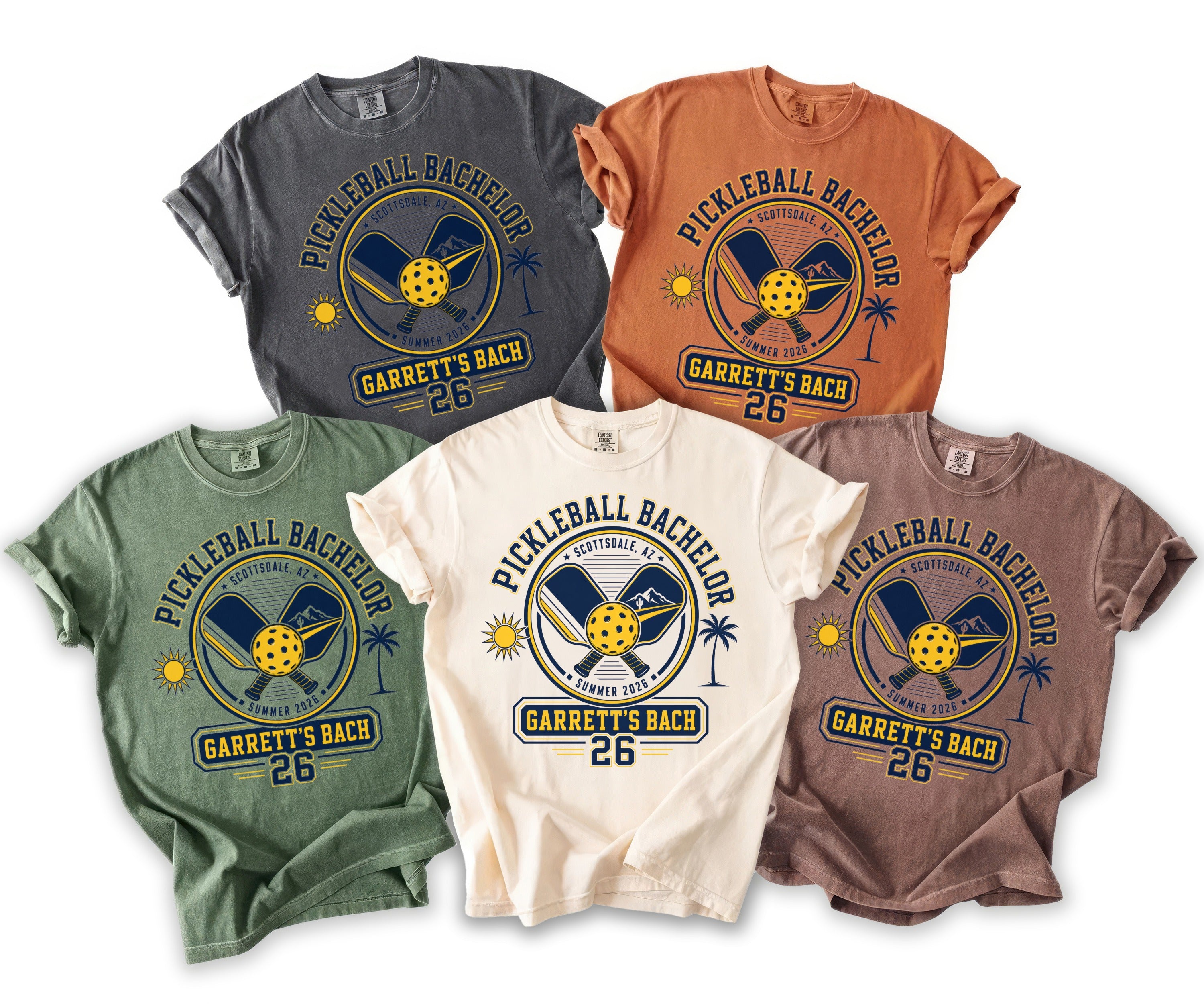 Five t-shirts in various colors featuring "Garrett's Bach 26" pickleball design.