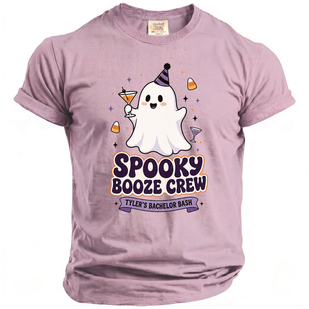 Lavender t-shirt with a ghost wearing a party hat and holding a drink, text says "Spooky Booze Crew Tyler's Bachelor Bash."