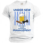 White t-shirt reading "Under New Management" with beer, cigar, and bow tie graphic.