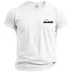 White Comfort Colors t-shirt with a black golf ball and grass design.