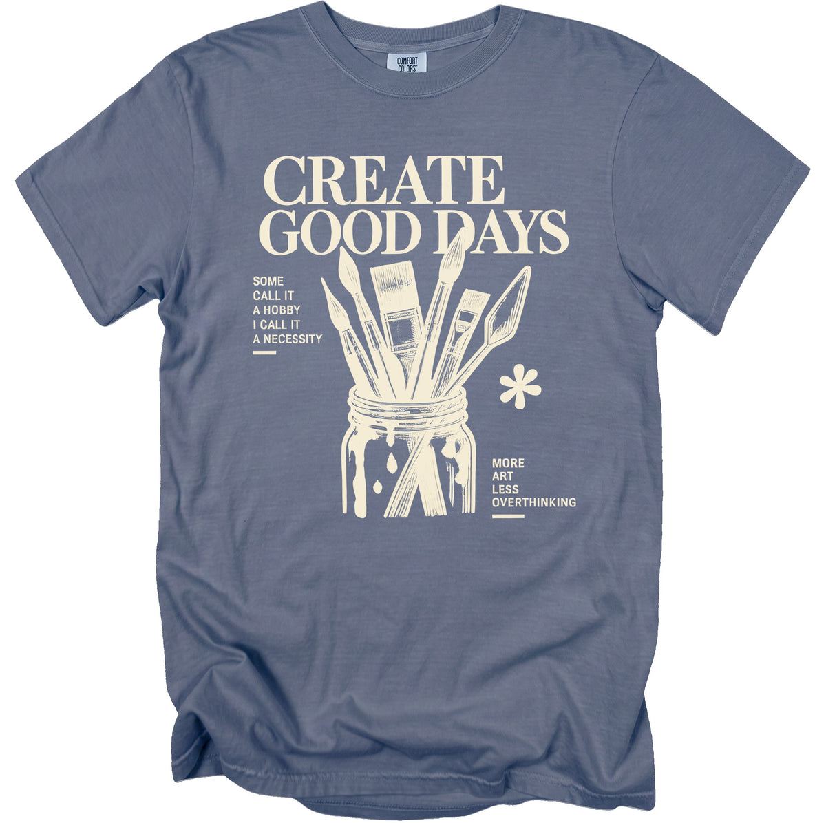 Blue t-shirt with "CREATE GOOD DAYS" and art supplies graphic.