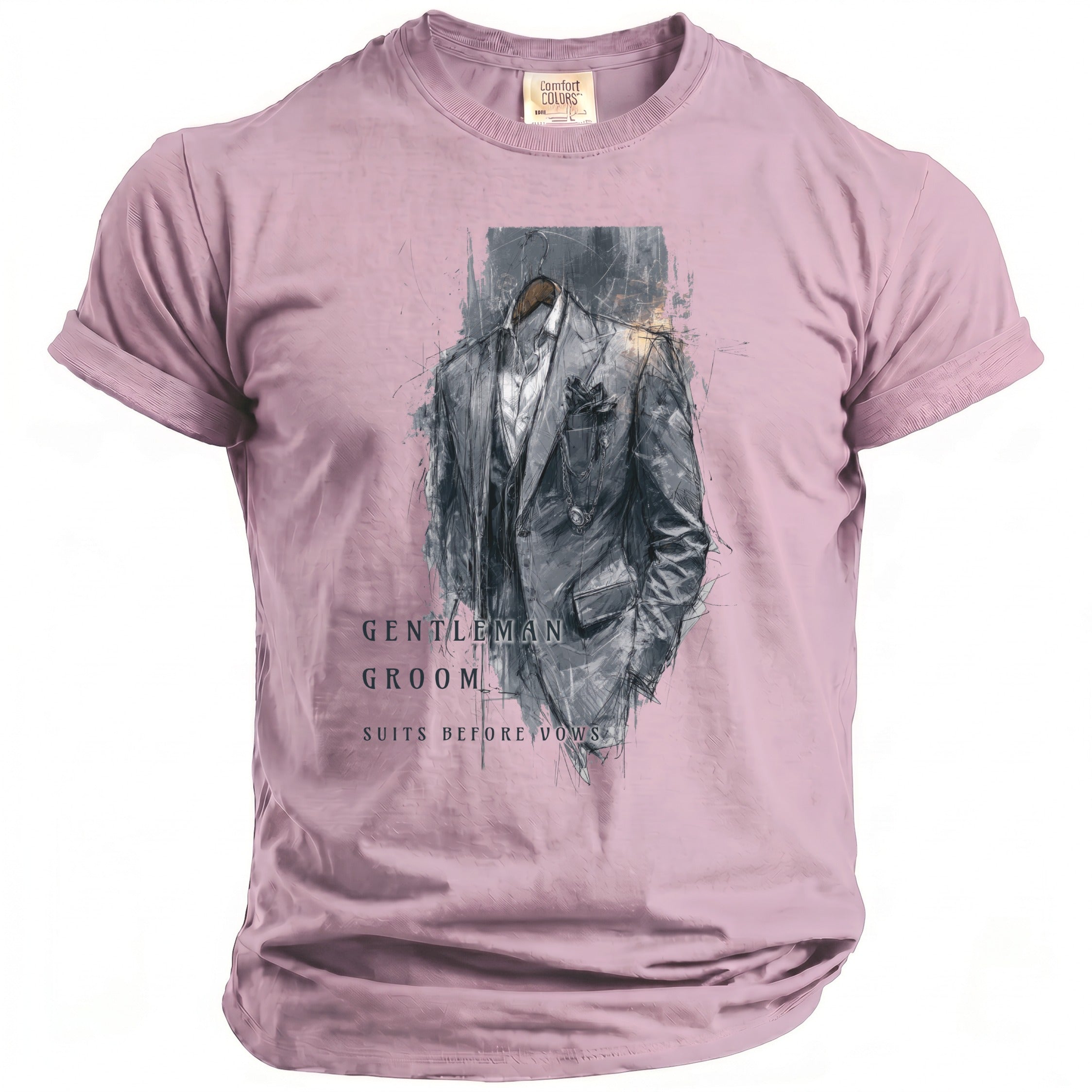Pink Comfort Colors t-shirt with a sketch of a suit and text: Gentleman Groom Suits Before Vows.