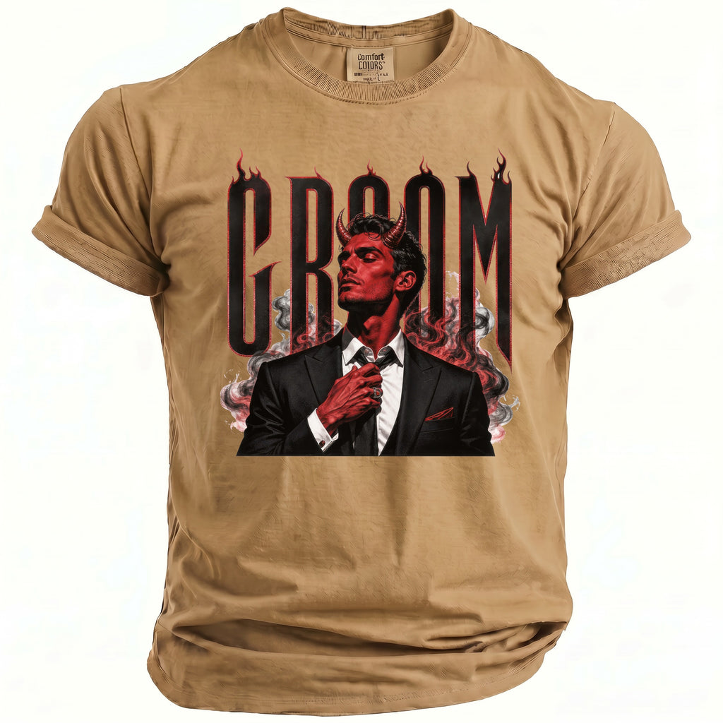 Tan t-shirt with a dark graphic featuring a devil with horns and smoking flames.