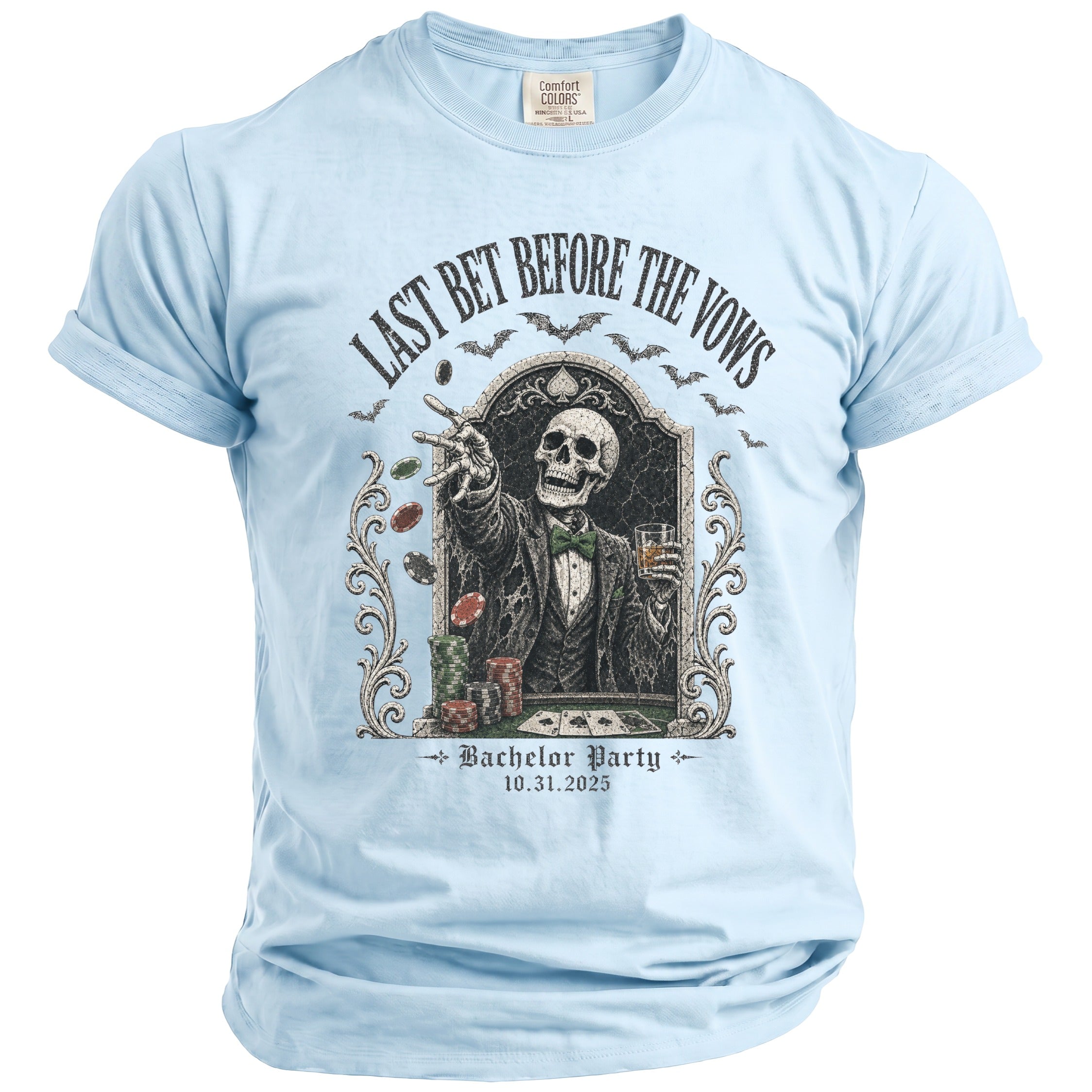 Light blue t-shirt with skeleton gambler graphic and "Last Bet Before The Vows Bachelor Party 10.31.2025" text.